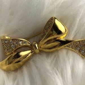 Vintage gold and crystal accent bow brooch